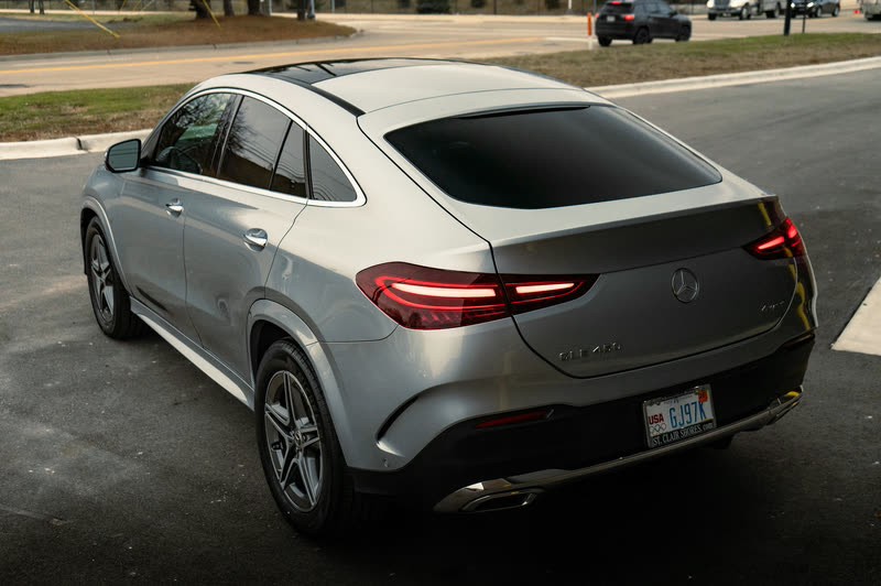 Silver Mercedes-Benz GLE coupe parked in front of a building