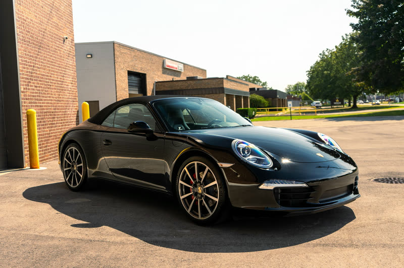 Porsche paint protection film: black Porsche 911 on an asphalt lot