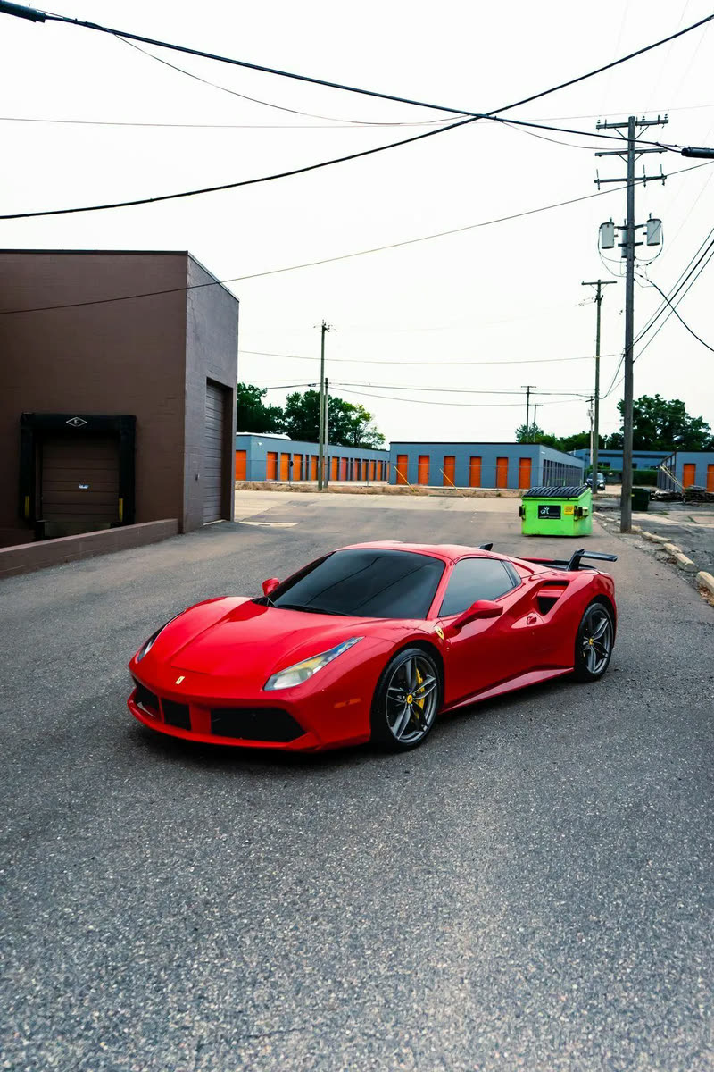 Red Ferrari 488, front three-quarter view